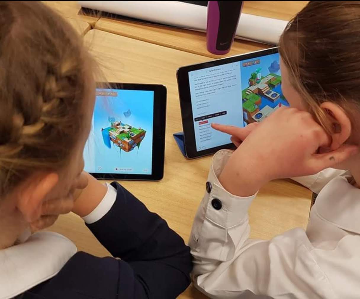 Students using tablets in a classroom learning activity